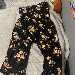 This is a torrid romper, black with floral print!